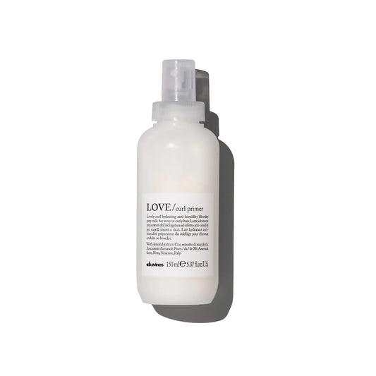 White bottle of Davines LOVE curl primer on a white background